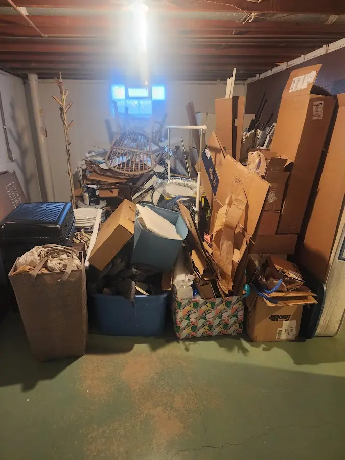 Roll-off dumpster container at job site for 8 Yard Dumpster Rental in Hamilton